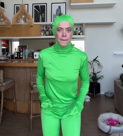 Mari Krüger dressed as a green bacterium